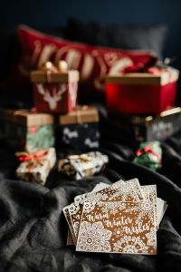 Kaboompics - Blurred Christmas Gifts beneath a Joy Banner