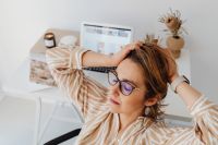 Kaboompics - Woman Relaxing with Laptop Background and Hands behind Head