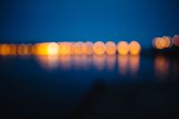 Kaboompics - Blurred city lights reflected in the water at night