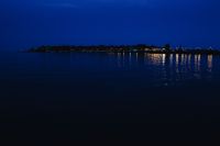 Kaboompics - City lights reflected in the water at night