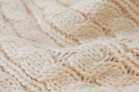 Kaboompics - Cream Cable Knit Sweater Texture Background
