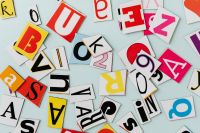 Kaboompics - Overlapping Paper Alphabet Cutouts in Bold Colors