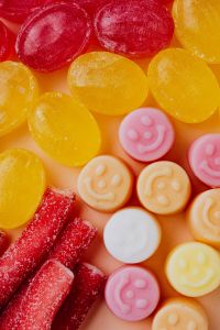 Kaboompics - Red, Yellow and Pink Smiley Face Jelly Candies, Bright Dessert Close-Up