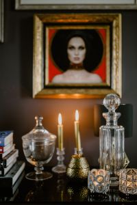 Kaboompics - Framed Portrait with Lit Candles and a Crystal Decanter