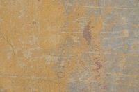 Kaboompics - Mustard Plaster Fading into Grey Concrete