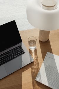 Kaboompics - Laptop Edge and Travertine Lamp in a Minimal Office Interior