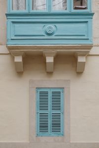 Kaboompics - Blue Maltese Window Detail with Decorative Stone Supports