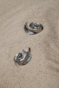 Kaboompics - Silver Spiral Earrings in the Sand