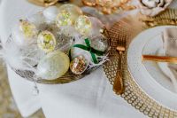 Kaboompics - Top-Down Easter Place Setting with Pastel Egg Basket, Gold Charger and Textured Linen