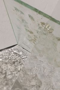 Kaboompics - Angled View of Layered Glass Sheets with Bubble Texture and Open Space