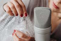 Kaboompics - Close-Up Bubble Wrap Crackling beside a Silver Microphone, ASMR Trigger