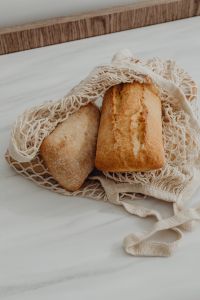 Kaboompics - Close-Up of Ciabatta and Baguette in a Cotton Mesh Bag