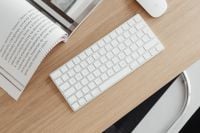 Kaboompics - Overhead Oak Desk Workspace with Keyboard and Open Magazine
