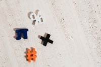 Kaboompics - Colorful Mathematical Symbols on a Neutral Stone Surface for Math Education and Classroom Graphics
