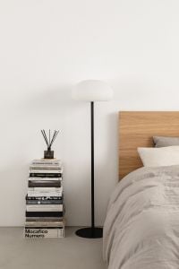 Kaboompics - Minimalist Bed Corner with Stacked Books