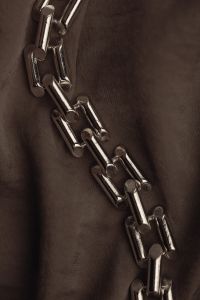 Kaboompics - Polished Silver Link Chain on Dark Draped Fabric