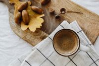 Kaboompics - Coffee and Acorns on Wooden Board with Checkered Cloth