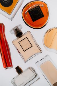 Kaboompics - Perfume Bottle Flat Lay Composition On White