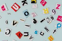 Kaboompics - Colorful Paper Letters with Copy Space on Light Blue