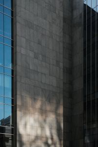 Kaboompics - Modern Glass Office Tower Against Blue Sky