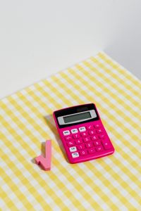 Kaboompics - Pink Calculator and Square Root Symbol in a Vertical Flat Lay