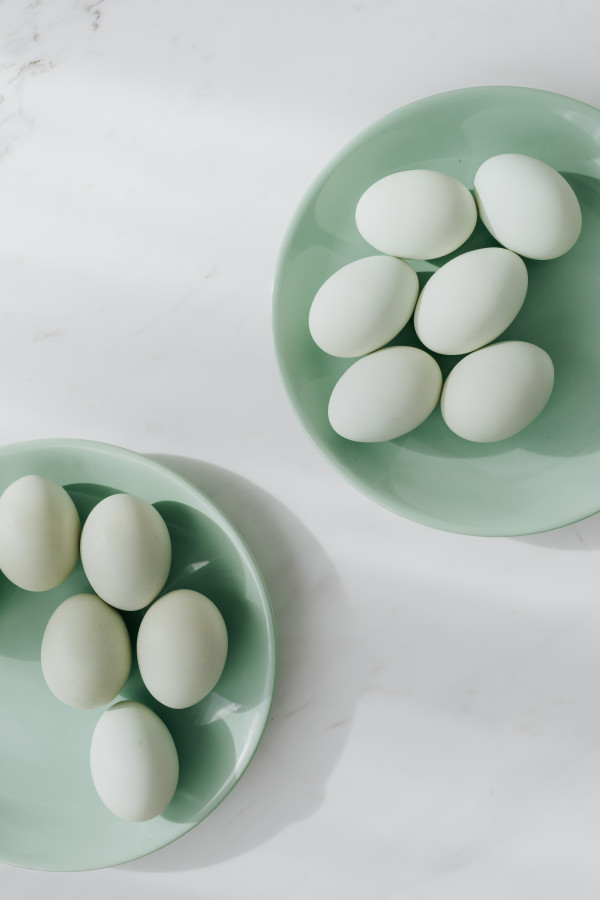 Spring Eos White Easter Eggs on Cropped Green Plates with Marble Space for Spring ...