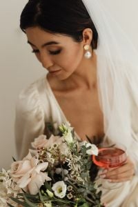 Kaboompics - Romantic Bridal Portrait With a Sheer Veil and Cream Flowers