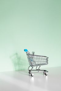 Kaboompics - Shopping Cart in Lower Corner on Minimal Mint Green Background