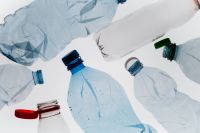 Kaboompics - Plastic Bottles and Crumpled Plastic Sheeting on White, Plastic Waste Concept