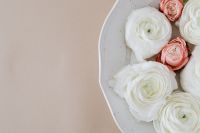 Kaboompics - Close-Up of White Ranunculus and Blush Roses on a Beige Background