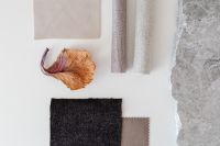 Kaboompics - Neutral Fabric Samples with Dried Leaf Accent