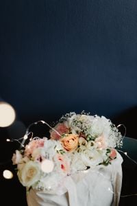 Bouquet of flowers in a bag with some fairy lights