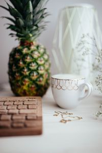 Kaboompics - Vertical Pineapple, Coffee Cup and Wooden Keyboard Desk Styling