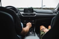 Kaboompics - Couple Traveling by Car with Dashboard and GPS in View