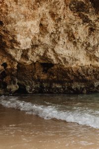 Kaboompics - Sandy Beach And Rocky Sea Cave With Shore Break
