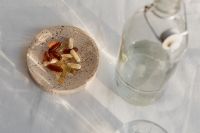 Kaboompics - Vitamins in a Bowl Beside a Bottle and Glass