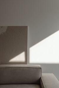 Kaboompics - Close-Up of Neutral Sofa with Geometric Wall Shadow