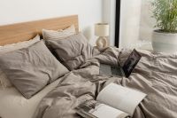 Kaboompics - Open Books on a Cozy Gray Bed