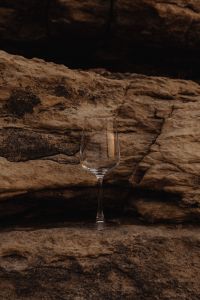 Kaboompics - Lone Wine Glass Framed by a Rugged Rock Face