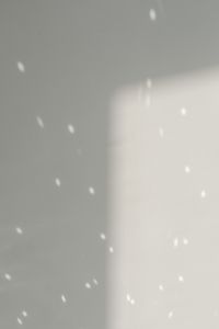 Kaboompics - White Wall with Sunlit Reflections and Bright Light