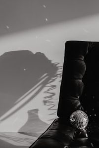 Kaboompics - Black Lounge Chair and Disco Ball Shadow in a New Year's Eve Party Setting