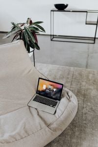 Kaboompics - Laptop on Cozy Sofa with Houseplant and Minimal Home Office Background