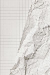 Kaboompics - White Graph Paper with Large Crumpled Sheet