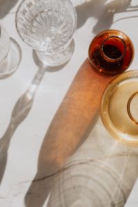 Kaboompics - Top-Down Glass Bottles and Crystal Glass with Warm Shadows