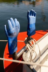 Kaboompics - Blue Fishing Gloves Drying on Boat