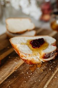 Kaboompics - Challah Toast With Honey and Raspberry Jam in Soft Focus