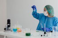 Kaboompics - Scientist Inspecting a Test Tube With Copy Space