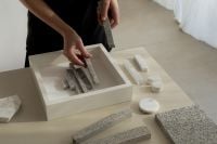 Kaboompics - Hand Arranging Textured Relief Sculpture for Framed Wall Art