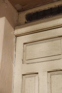 Kaboompics - Weathered Cream Paneled Door with Dark Transom Window