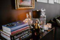 Kaboompics - Elegant Home Decor with Books, Candlesticks and Glass Decanters